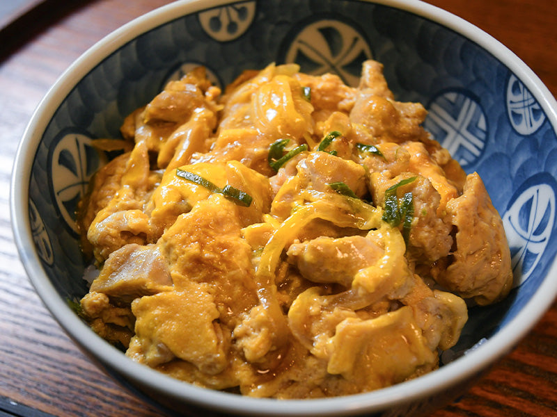 Oyako-don (Chicken and egg rice bowl) with dashi soup stock