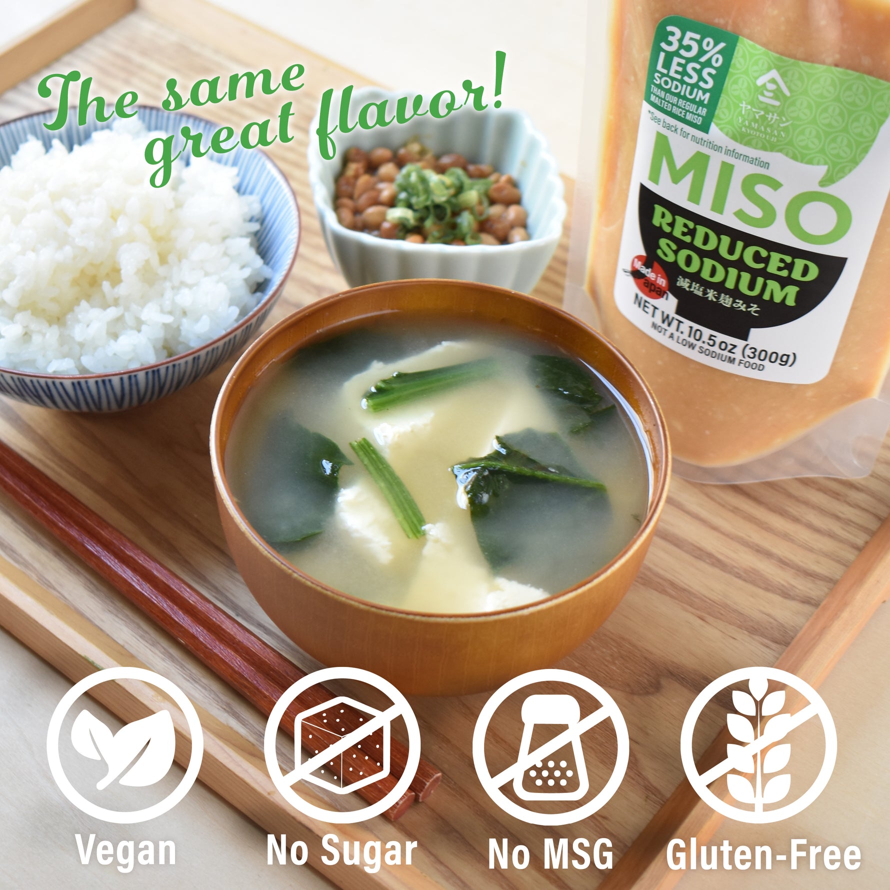 Bowl of miso soup with ingredients and a bottle of reduced sodium miso on a wooden board.