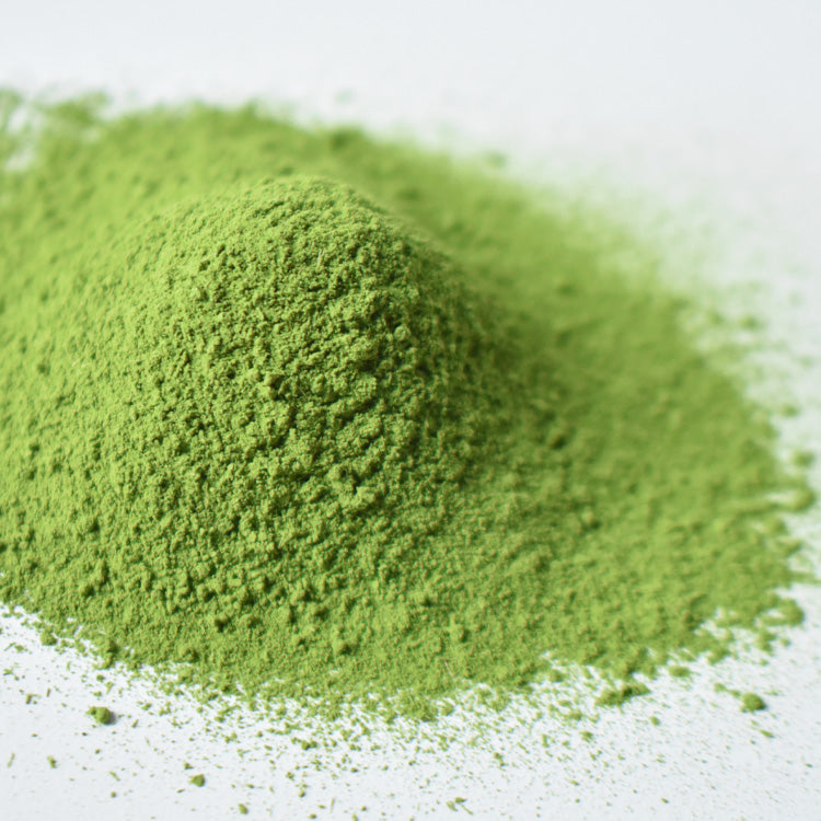 Close-up of green powder on a white background