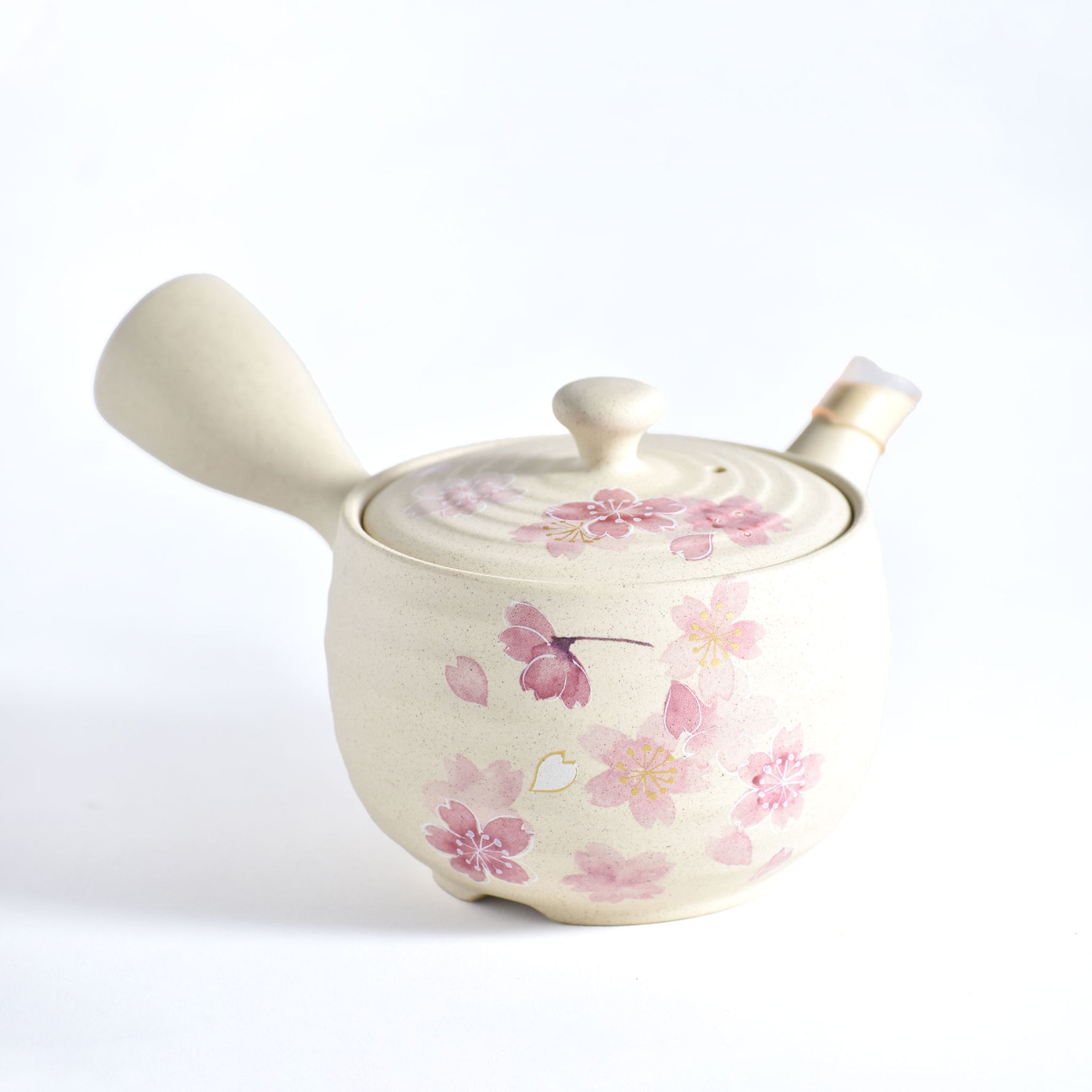 Ceramic pot with floral design on a white background