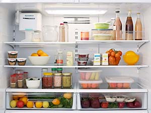 Fridge with various food items on different shelves