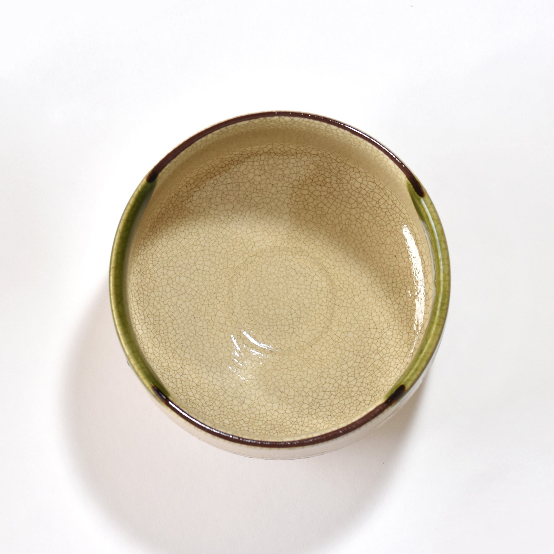 Ceramic bowl with a textured surface on a white background