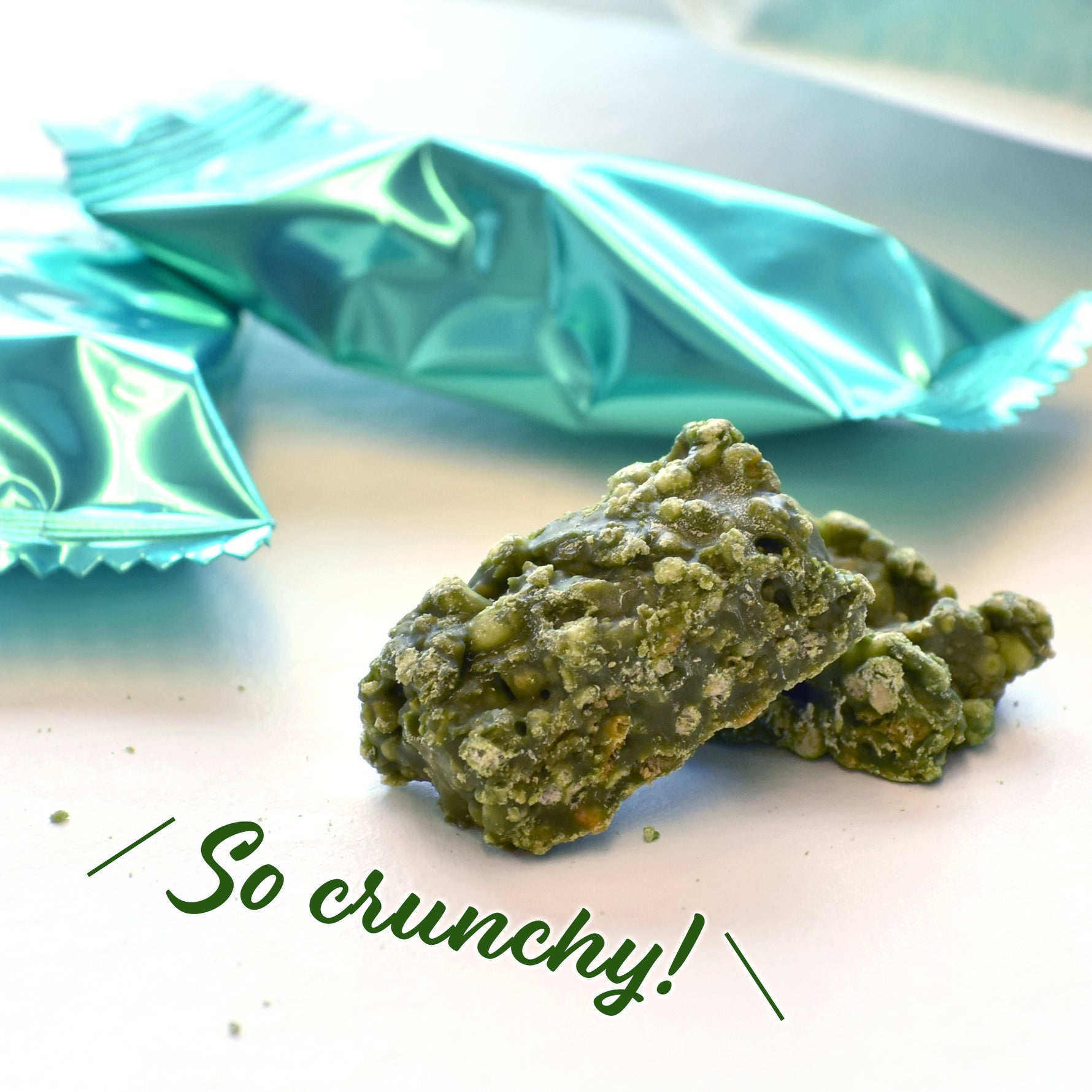Green crunchy snack with teal packaging in the background