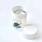 Open container of Japanese Organic Matcha Homare on a white background 100g ceremonial grade