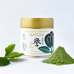 Container of Japanese Organic Matcha with matcha powder and leaves on a white background