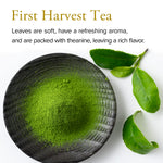 Green tea powder in a black bowl with green leaves on a white background, featuring text about 'First Harvest Tea'.