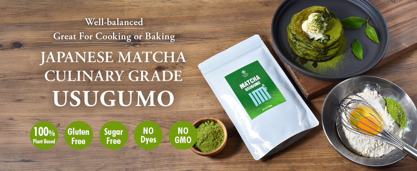 A package of Japanese matcha culinary grade usugumo (matcha powder) is displayed on a rustic wooden table alongside culinary props, including a bowl of green matcha dessert, a whisk with flour and green powder, and a small bowl of matcha powder.