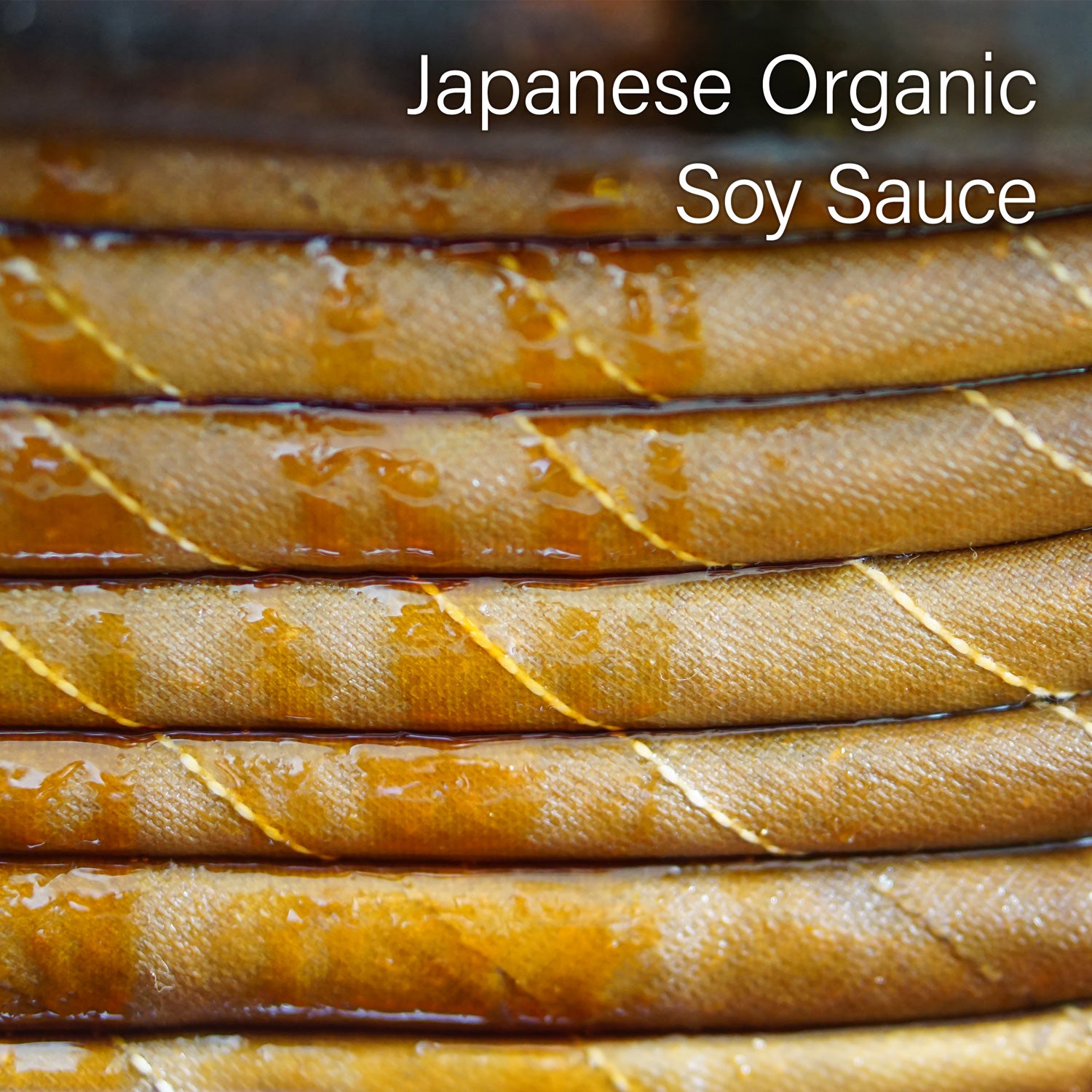 Stack of Japanese Organic Soy Sauce bottles with text overlay
