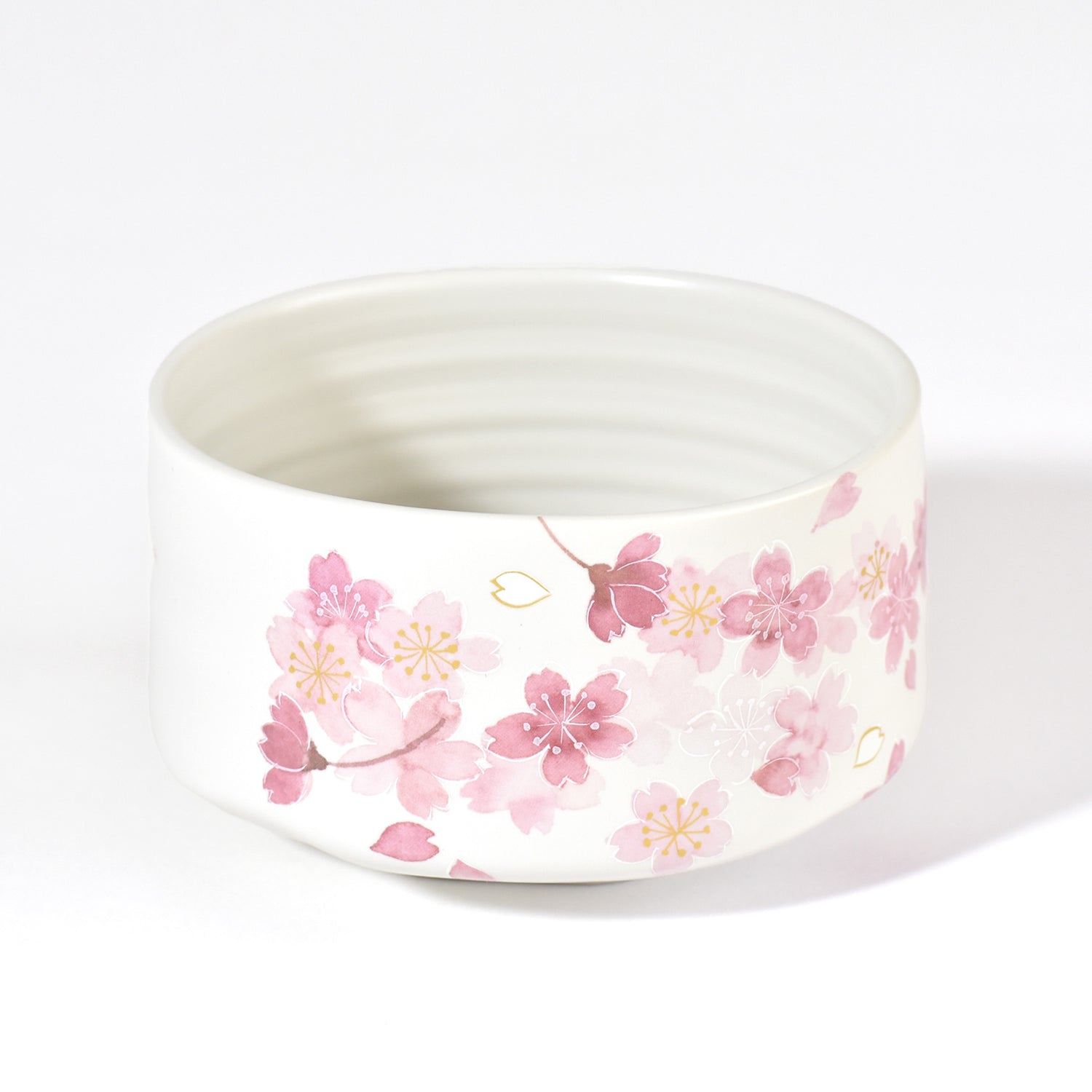 Ceramic bowl with pink floral pattern on a white background