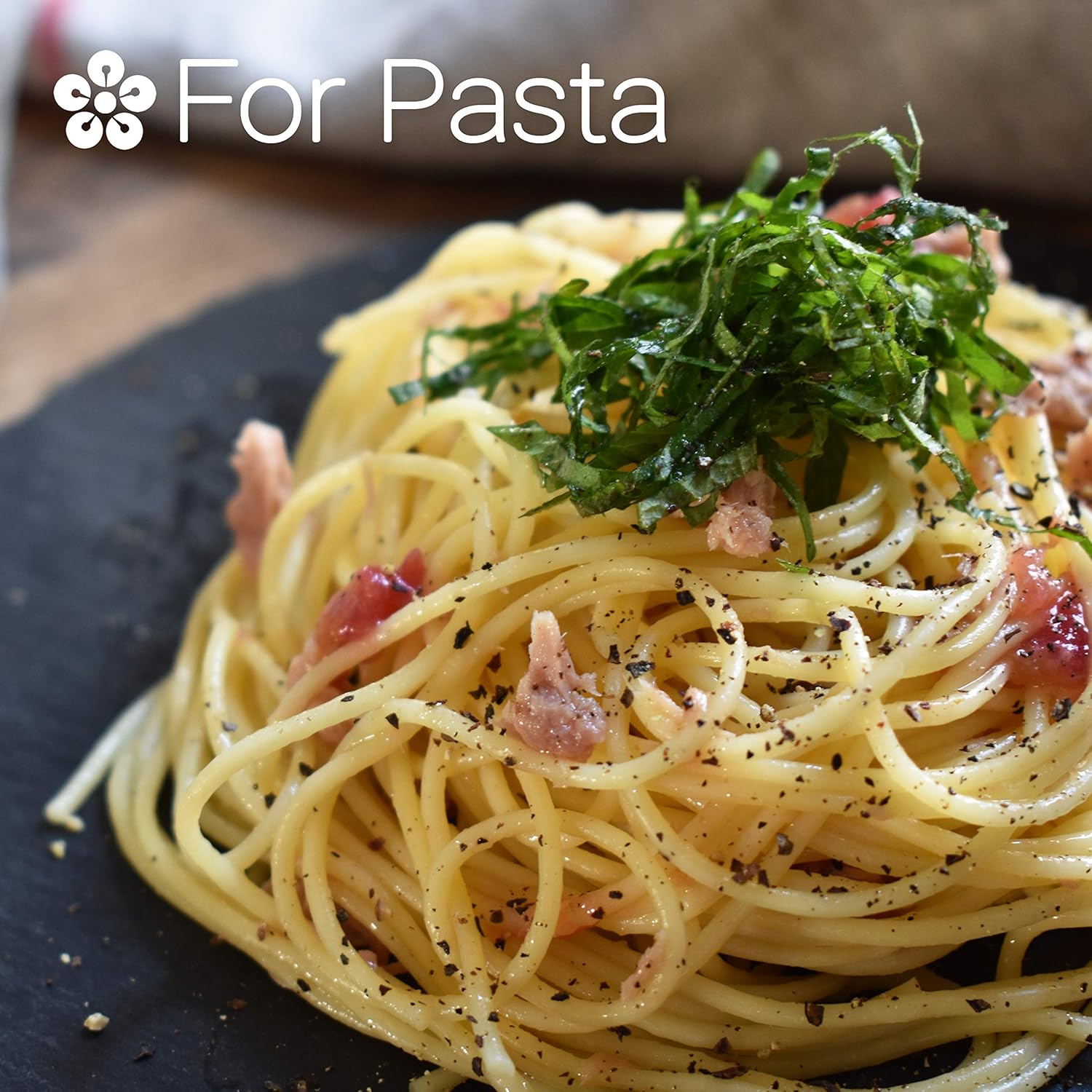 Spaghetti dish with bacon and herbs on a dark plate, labeled 'For Pasta'.