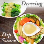 A beautifully presented dish of fresh vegetables with a side of white miso dressing on a wooden surface